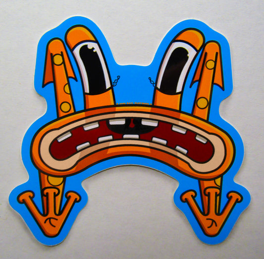 A close-up picture of a single sticker from BAIL clothing's sticker pack. Cartoonish, orange frog character with long eyes, an exaggerated frown, and whimsical design flying through the air as it gets thrown off of a skateboard in the skatepark. It conveys a humorous, quirky and relatable expression.