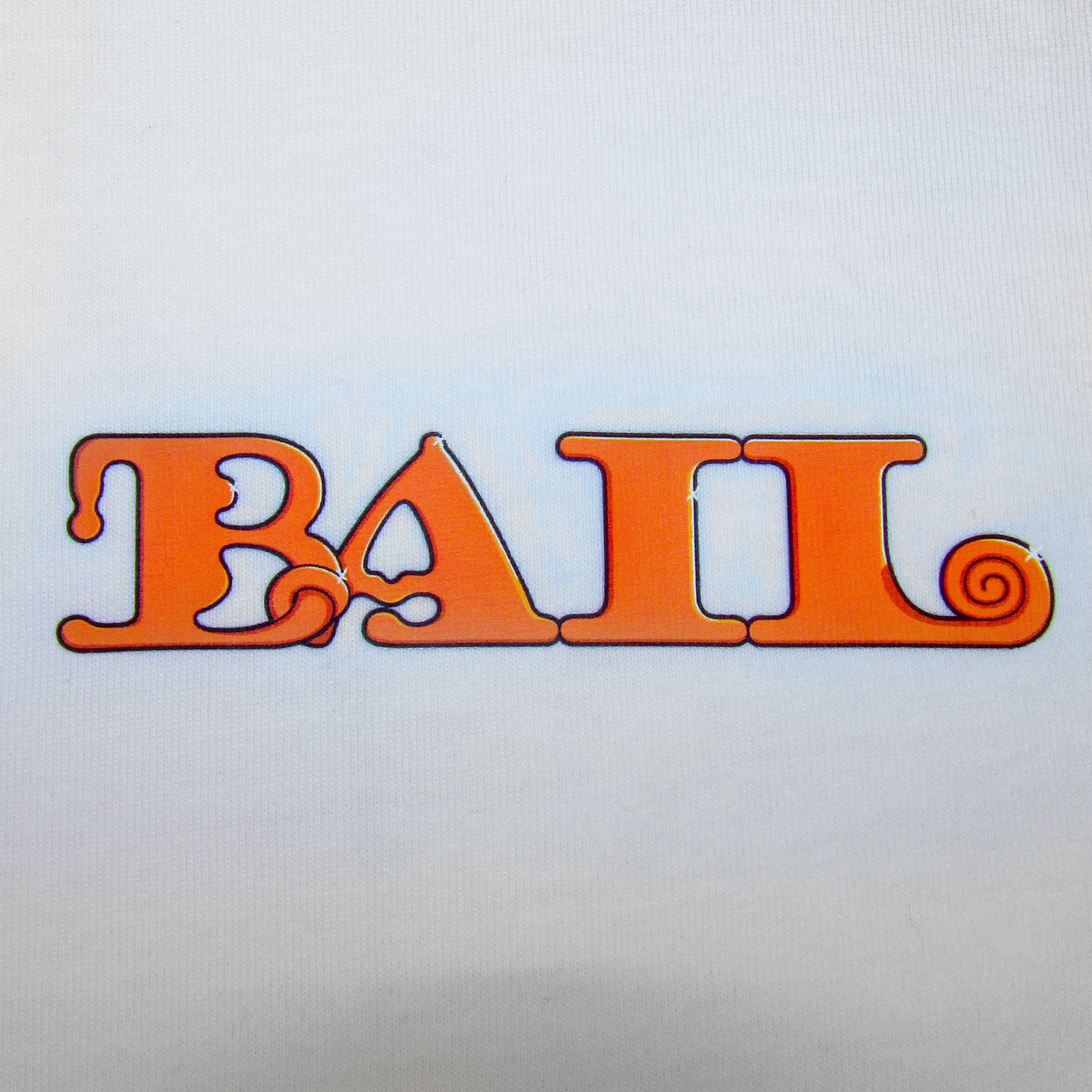 A close-up of the word "BAIL" in bold, decorative orange letters with playful, swirly elements printed on high-quality white 100% cotton fabric.